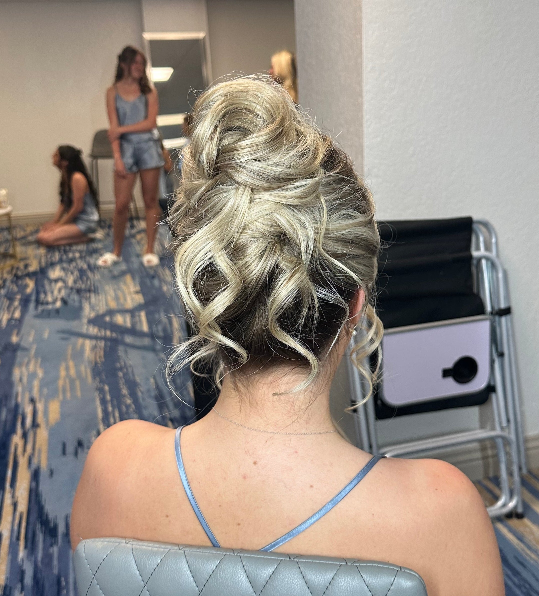 Romantic textured bridal updo hairstyle for blonde Florida bride by Glow & Go Beauty