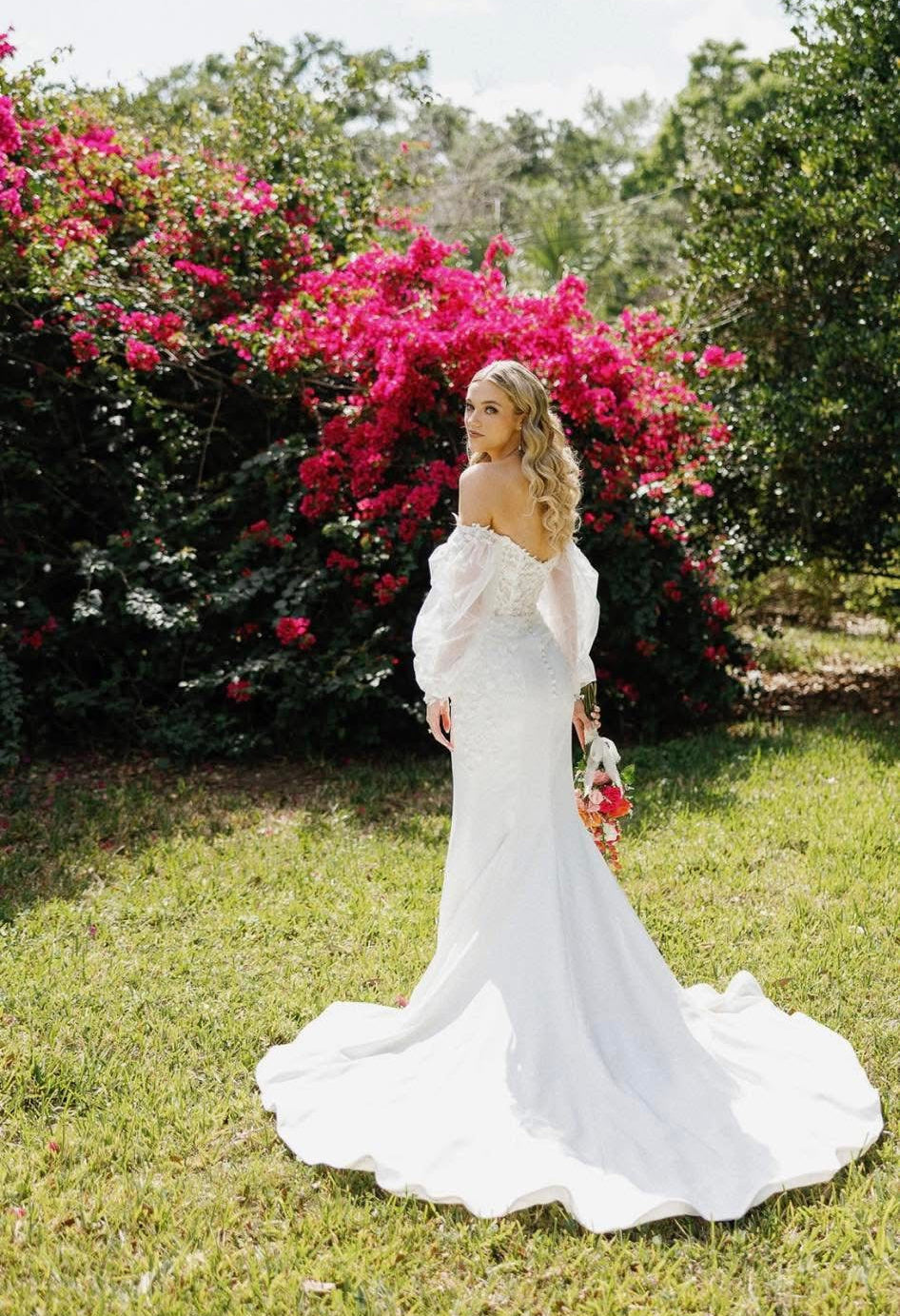 Romantic garden bridal portrait with bride in white wedding dress by Glow & Go Beauty